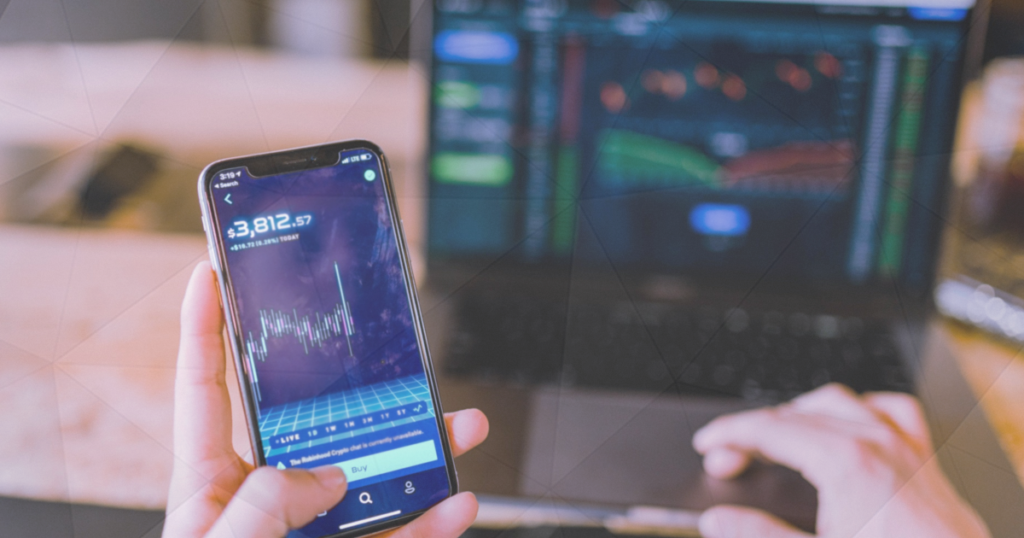 Best Forex Indicators a man checks on his phone